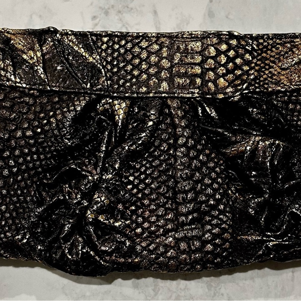 3 genuine chic leather clutches all perfect condition and neutral color ways.